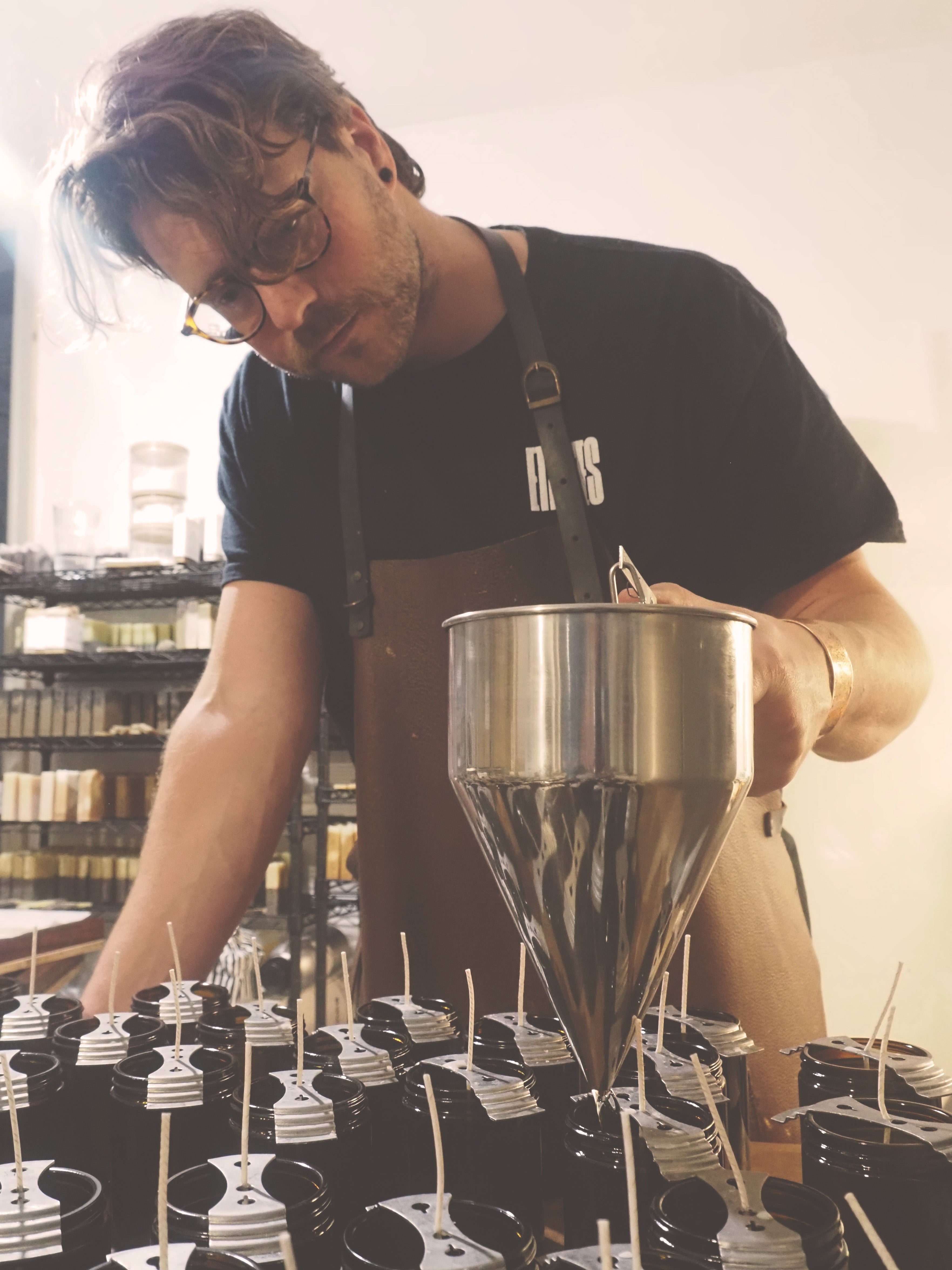 Rooted – Pumpkin Spice Inspired Candle with Essential Oils | Autumn & Christmas Scent being hand-poured in the workshop.