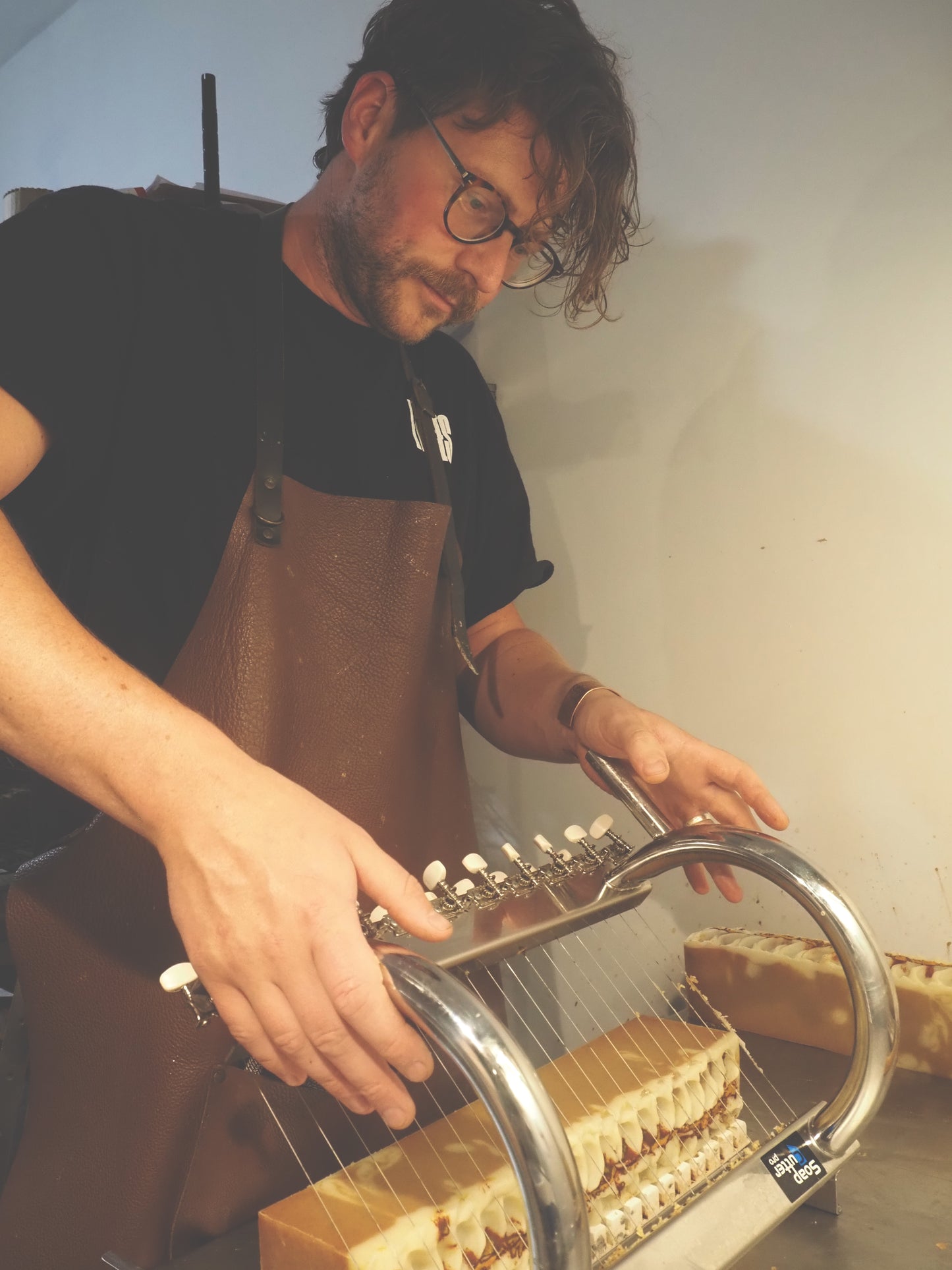 Lavender Goat Milk Soap – Natural, Handmade Cold Process Soap from Lancashire being cut by a soaper in apron.