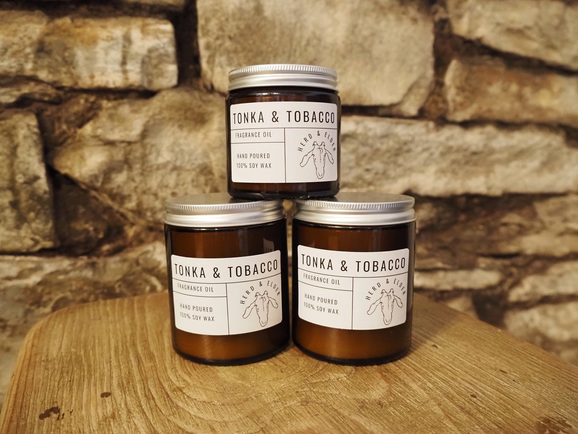 tonka and tobacco leaf candle Crafted in an upcycled wine bottle with a sustainable hemp wick. Spiced Honey & Tonka Candle